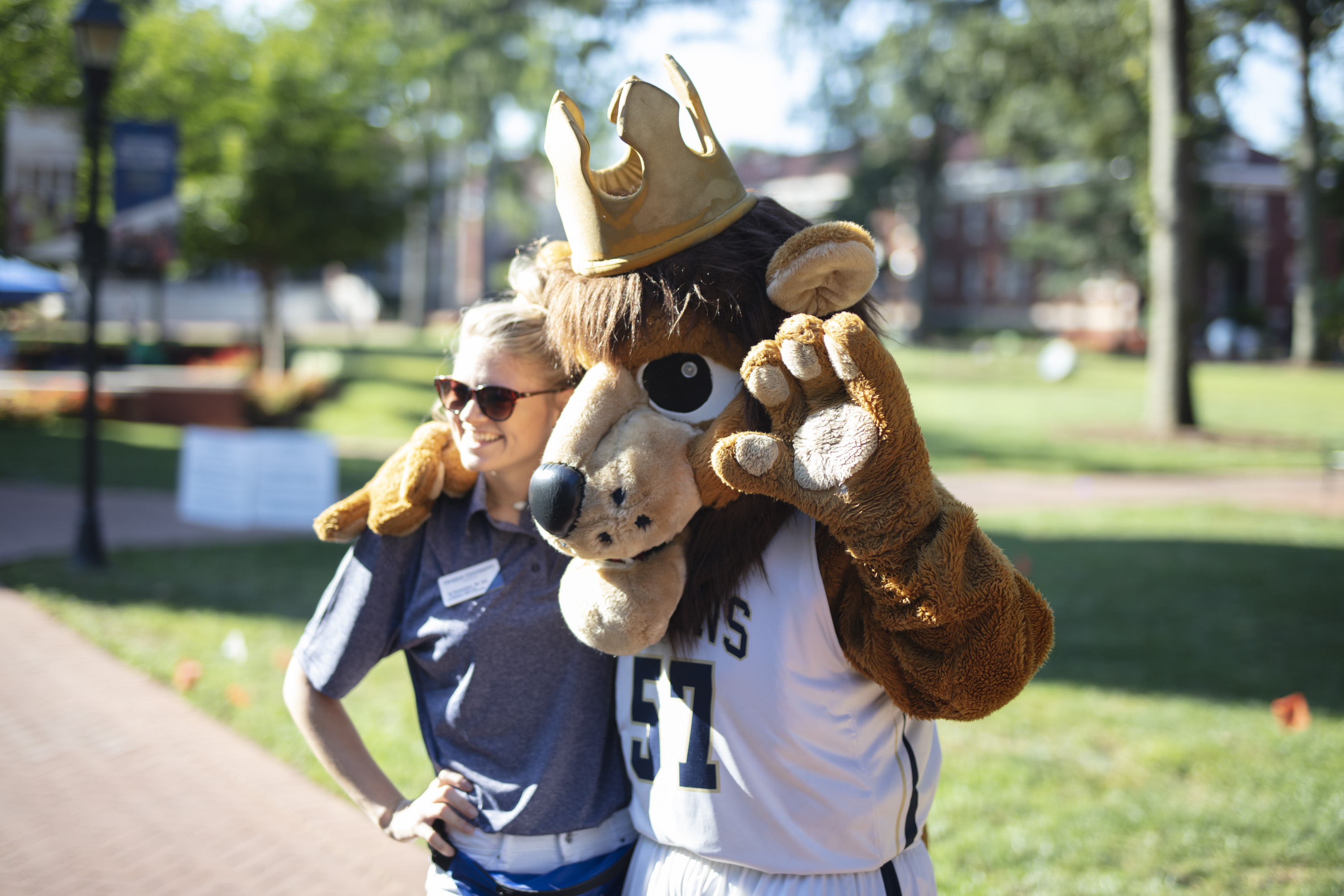 Life at Queens: Student with Rex the Mascot