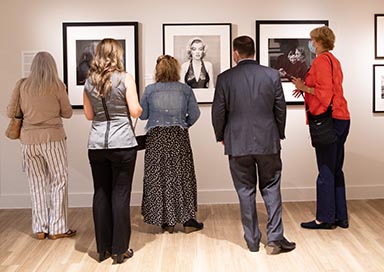 People looking at art in gallery