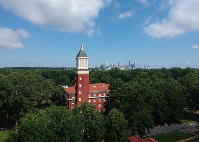 Aerial view of clocktower and Uptown skyline