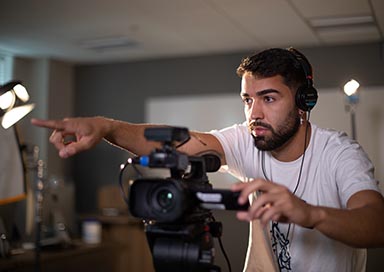 Student working with video camera