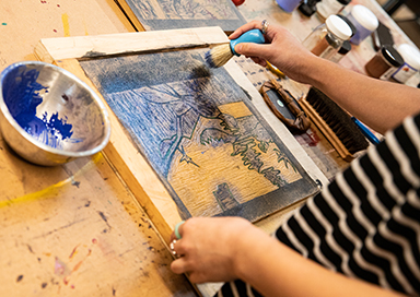 Student working with powdered paint