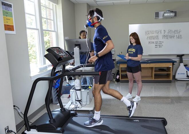 Students testing athlete in Fitness Lab