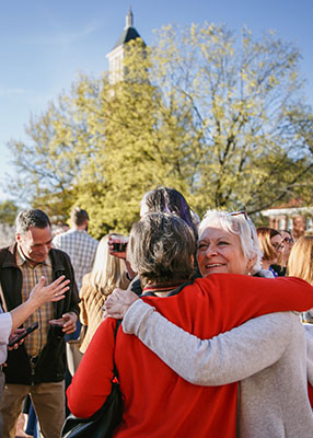Alumni hugging at reunion weekend