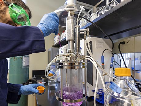 Student working with chemistry equipment