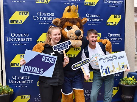 Students with mascot at new brand launch
