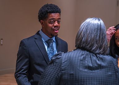 Student talking with judge