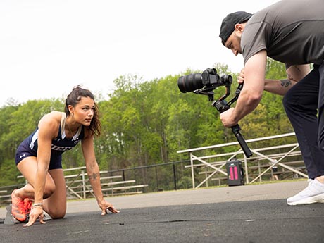 Track student being filmed for D1 commercial