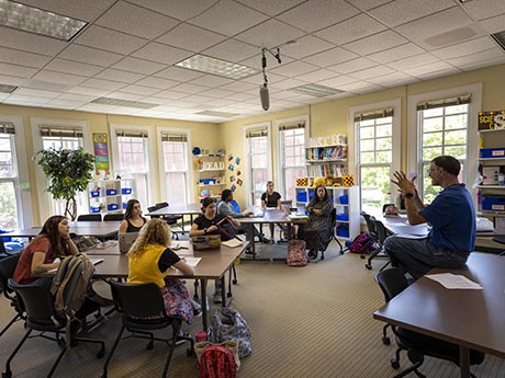 Students in elementary school style classroom