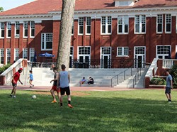 Students playing soccer in Resident Quad