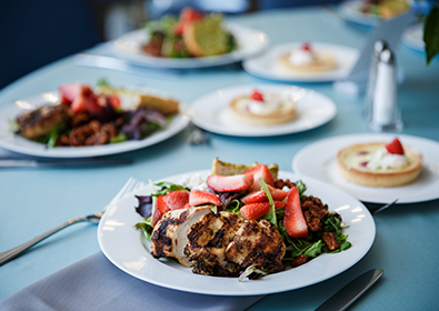 Chicken salad with strawberries on table