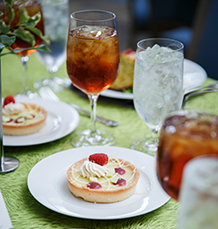 Tart with sweet tea on table