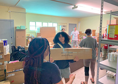Students helping move boxes