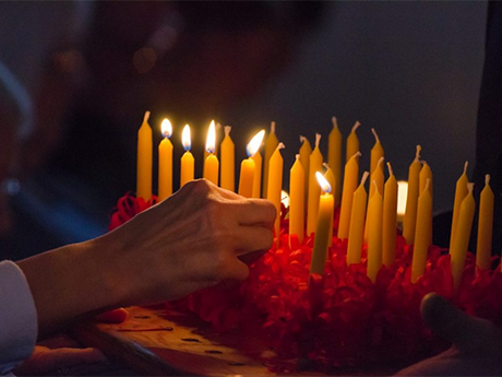 Woman lighting candles