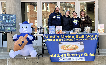 Students serving Matzah Ball Soup at Chanukah