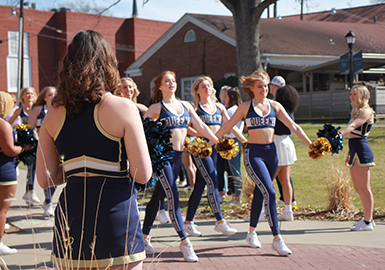 Cheerleaders and dancers leading parade