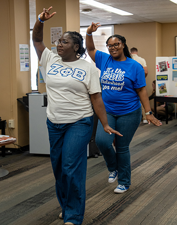 Zeta Phi Beta sisters dancing