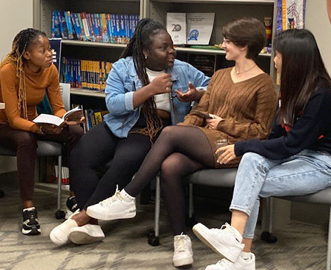 Four Students Talking at International Tea