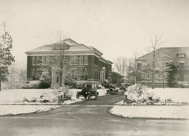 Model T Fords at the front of campus