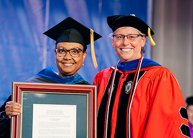 Dr. Clifton accepting award from Dr. Fatherly