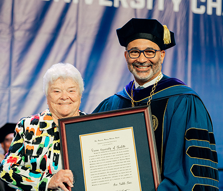 Sue Ross accepting award from President Lugo