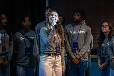 Queens student speaking during presentation
