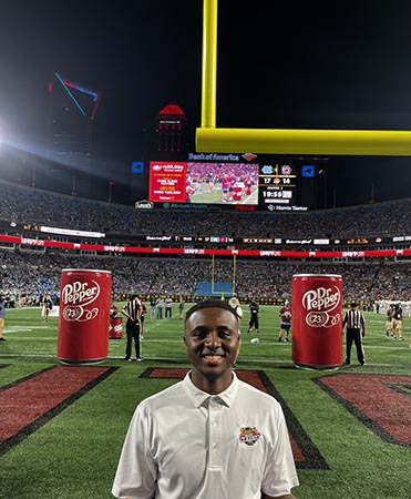 Andre Myrie at Panthers game on the field