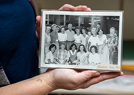Sarah Sowa holding old class photo