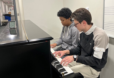 Ian Hirsh and J Evans at piano