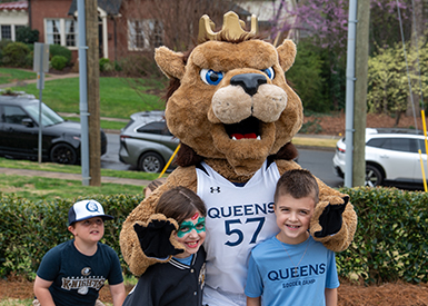 Rex the mascot with summer camp kids