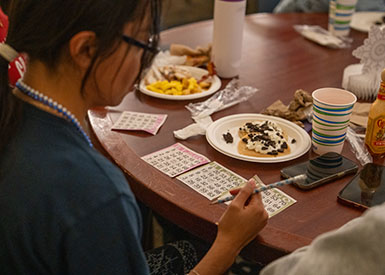 Student playing Bingo at Exam Break Breakfast