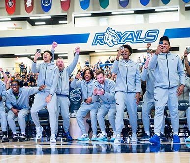 Men's basketball team celebrating selection sunday pick