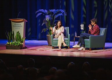 Farahany and Thompson speaking on stage