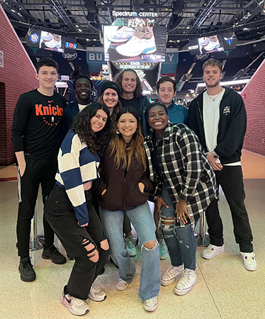 Lauryn Futrell and group at Hornets game