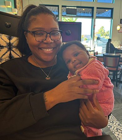 Nikel Malone with daughter