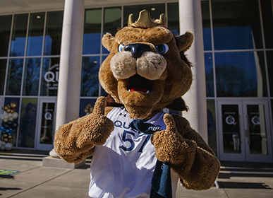 Rex mascot giving two thumbs up