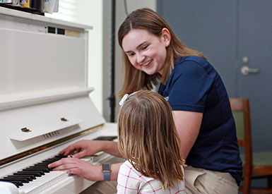 Music therapy, Gabby Frens, and child at piano