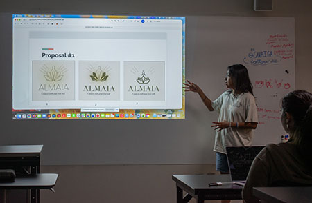 Anahi Maciel presenting designs